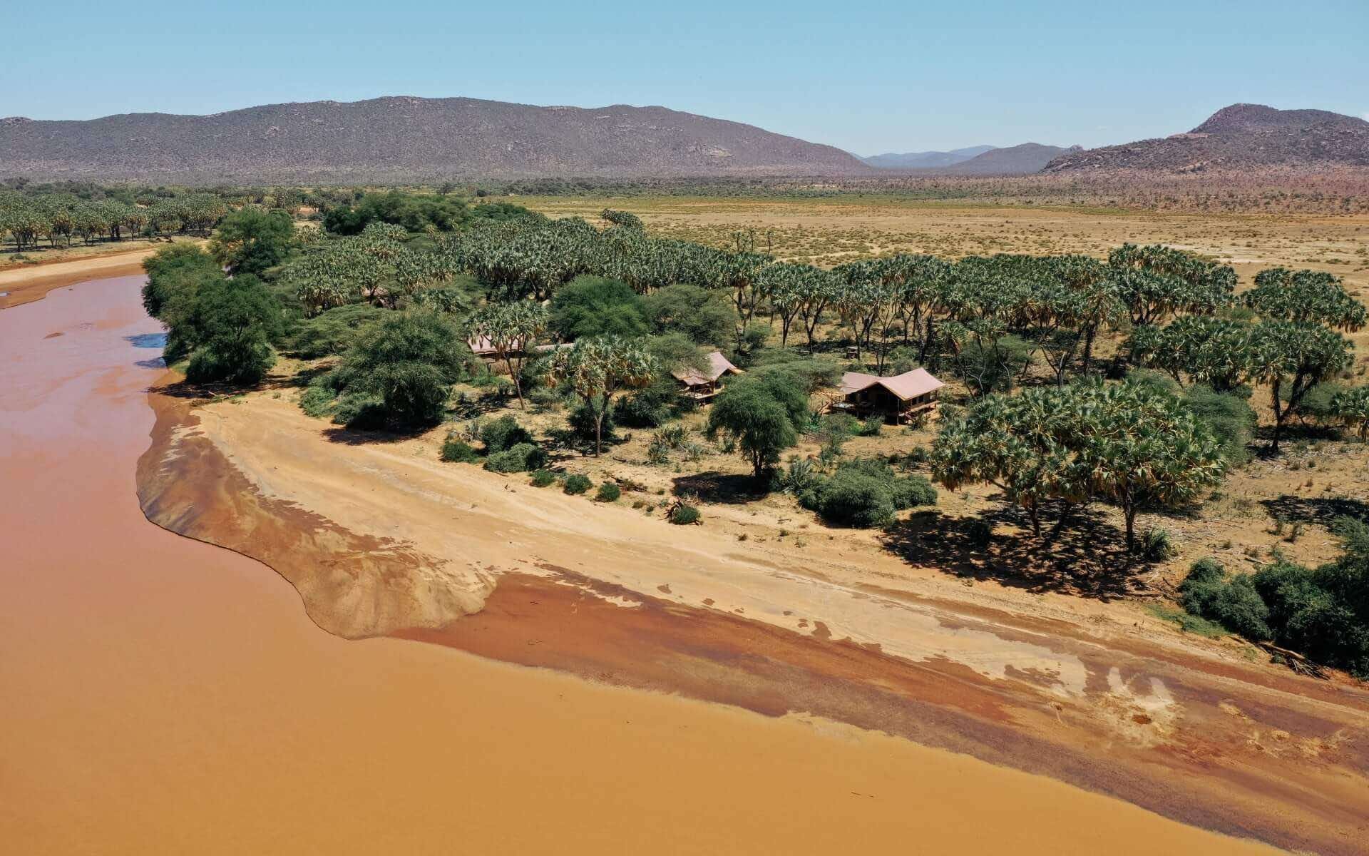 Elephant Bedroom Camp is surrounded by desert, trees and the river.