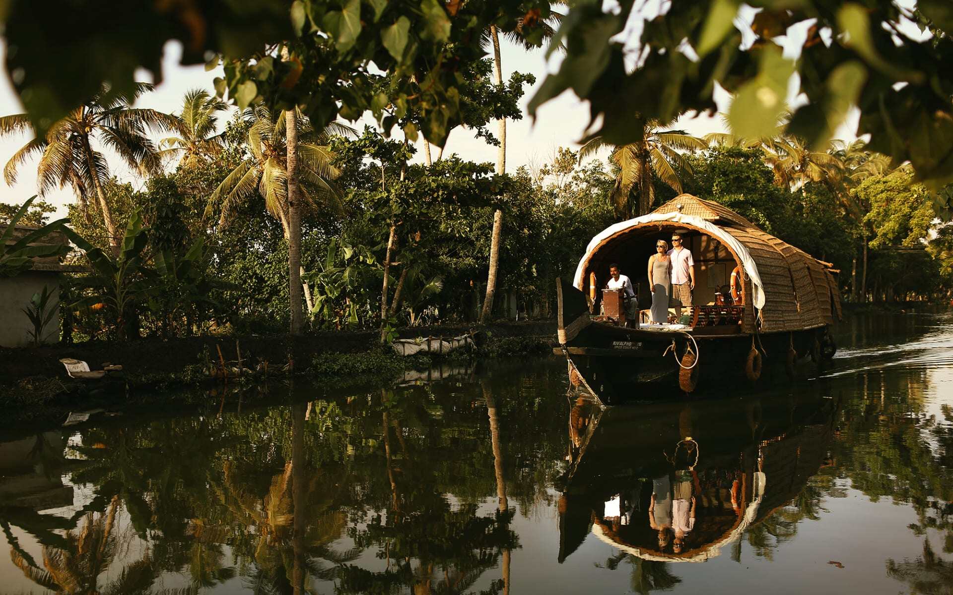 The traditional houseboat at Spice Coast has an enclosed part and an exposed front.