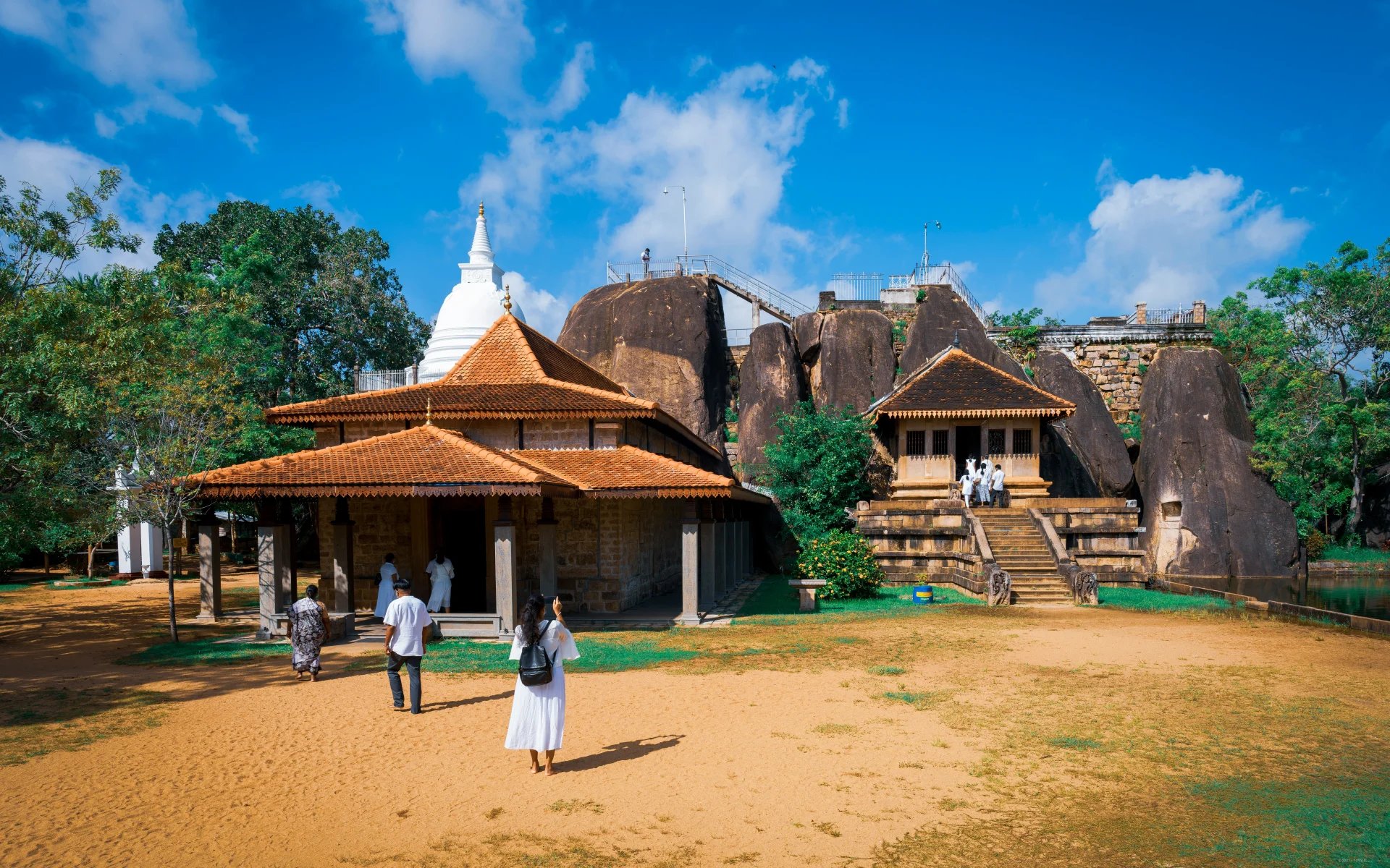 Visitors walking around the ancient capital of Anuradhapura.