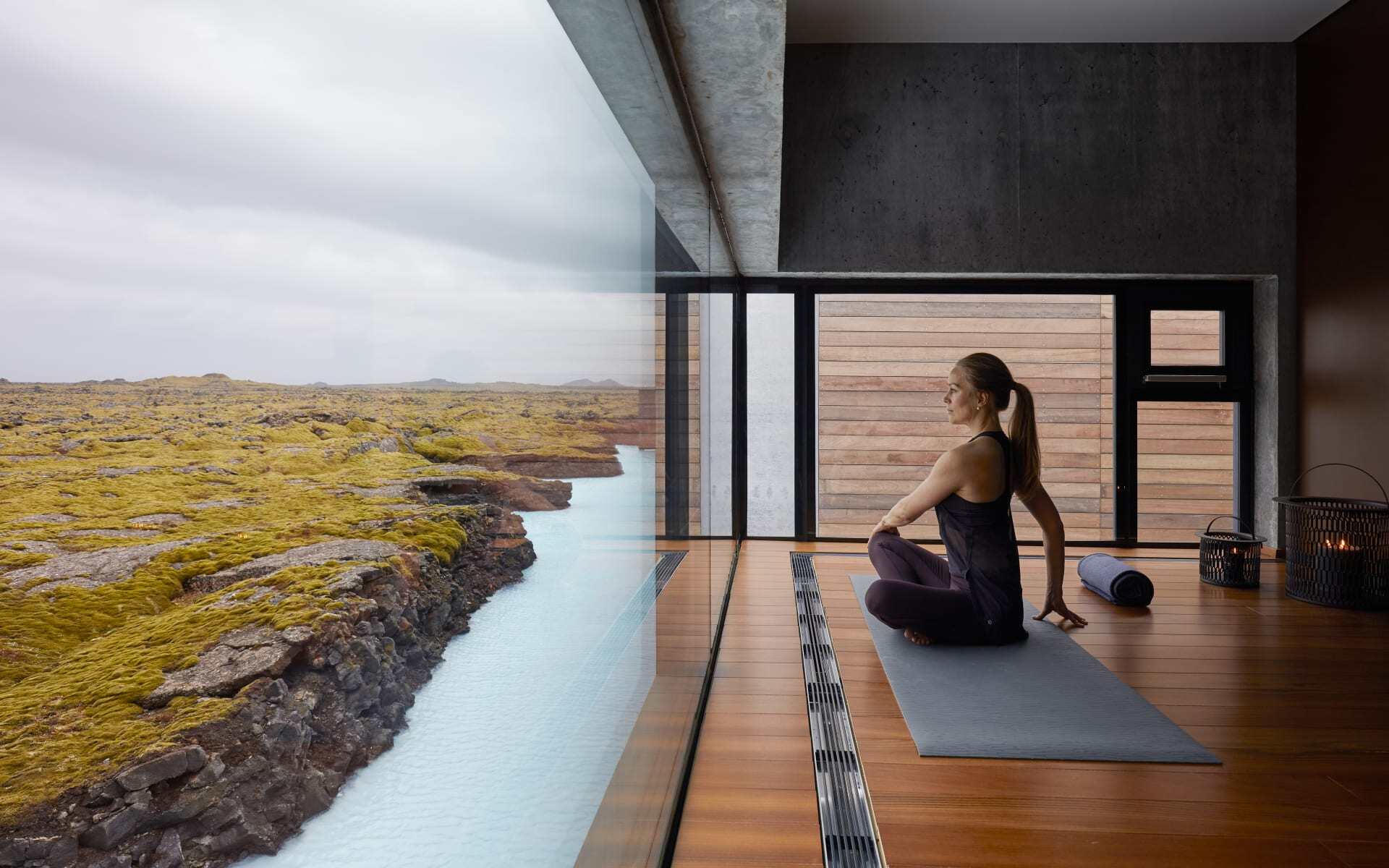 A lady enjoys a panoramic view during yoga at the Retreat Hotel.