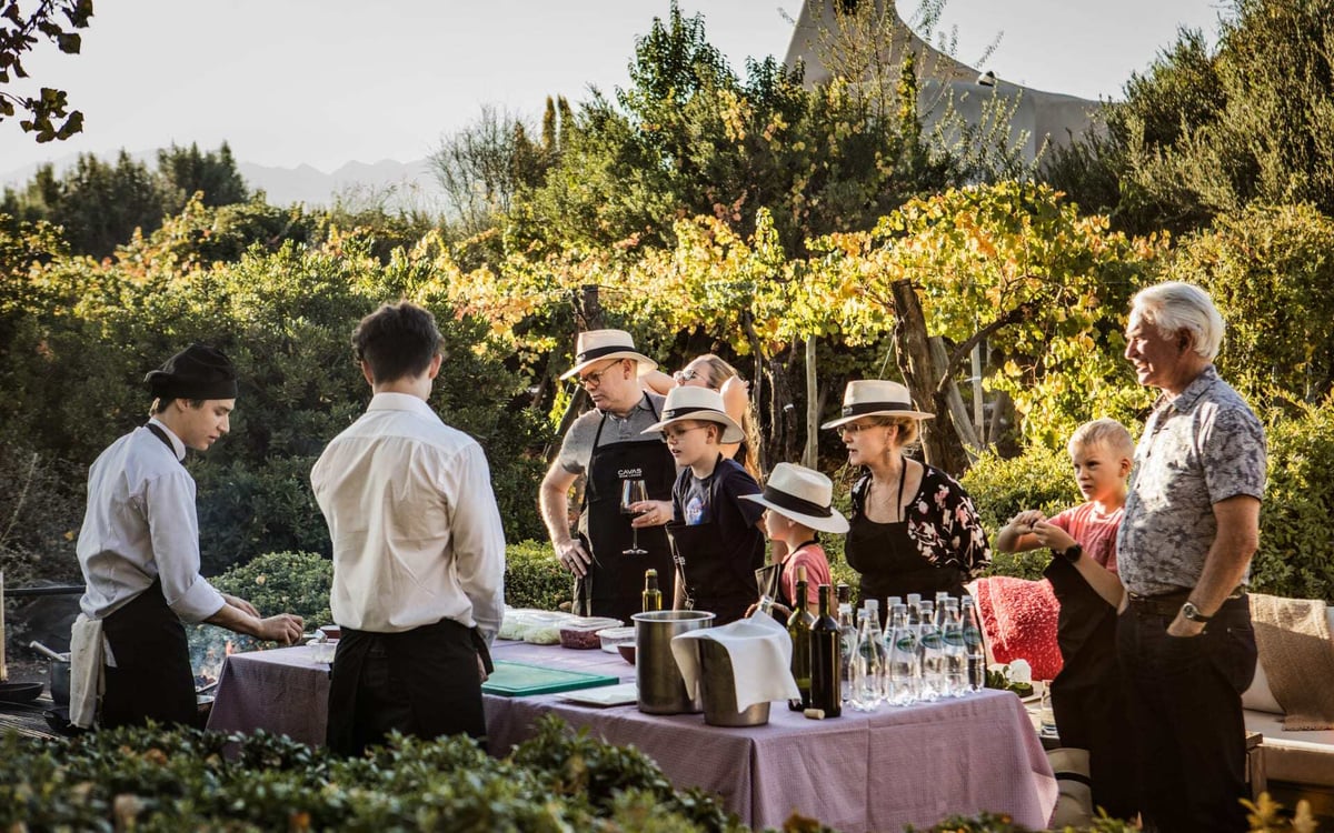 A family enjoy food and wine at Cavas Wine Lodge in Argentina.