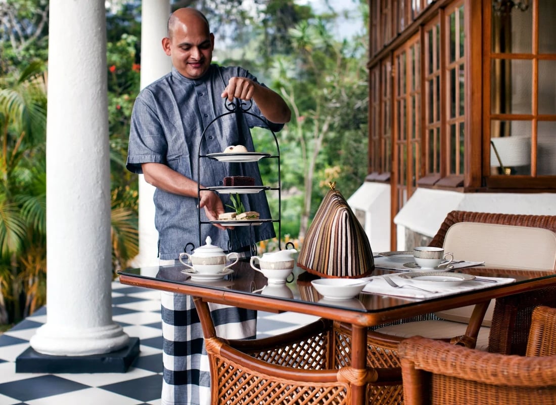 Afternoon tea is being served by one of the friendly waiters.