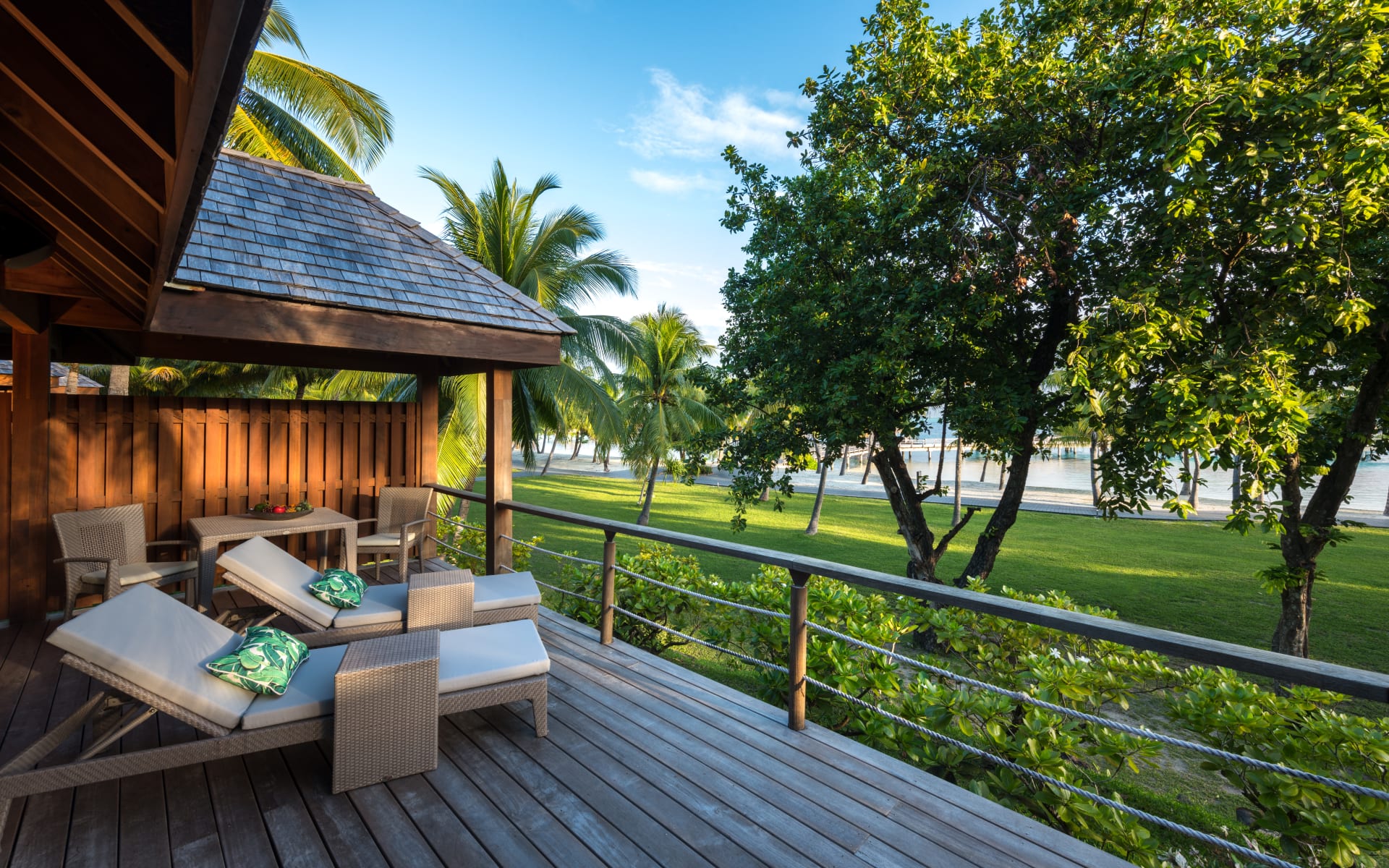 Two sun loungers are overlooking the garden. 