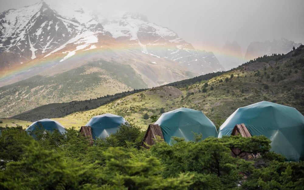 Eco Camp Patagonia has luxury tents with a mountainous backdrop.