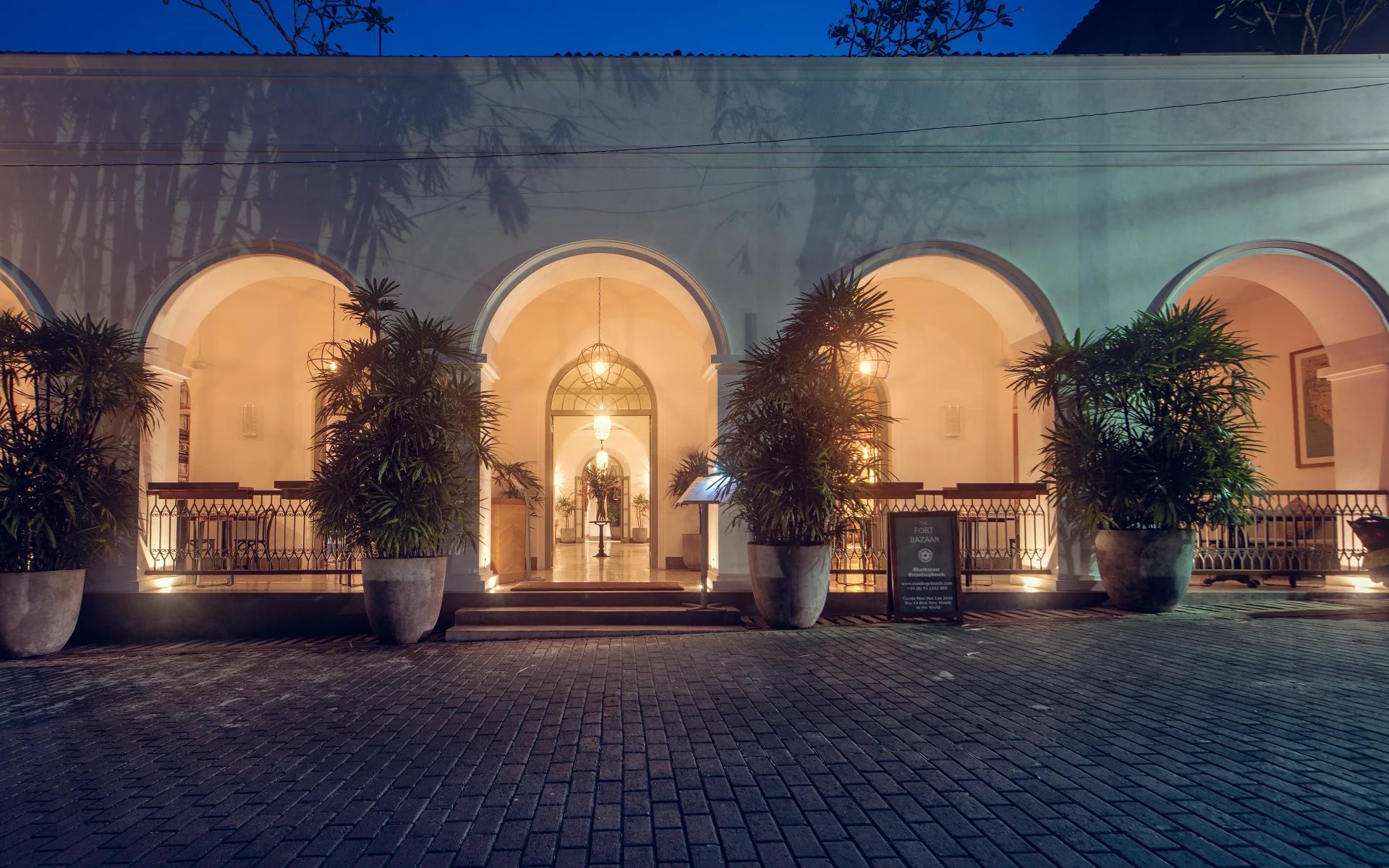 The entrance to Fort Bazaar has several archways leading into a warmly-lit entrance hall.
