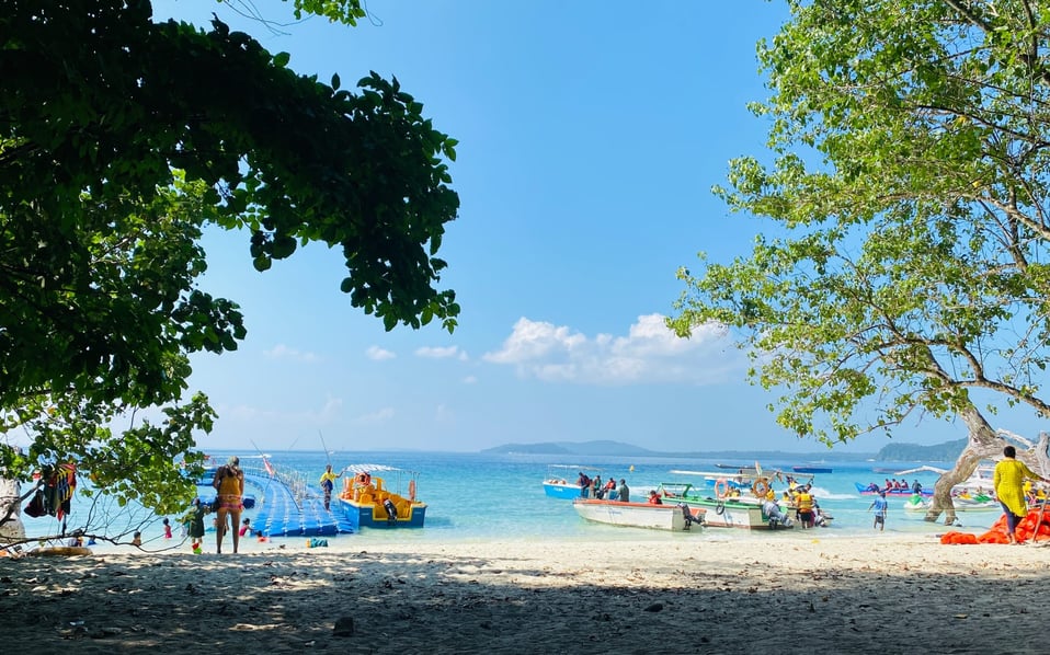 people on a beach on an island