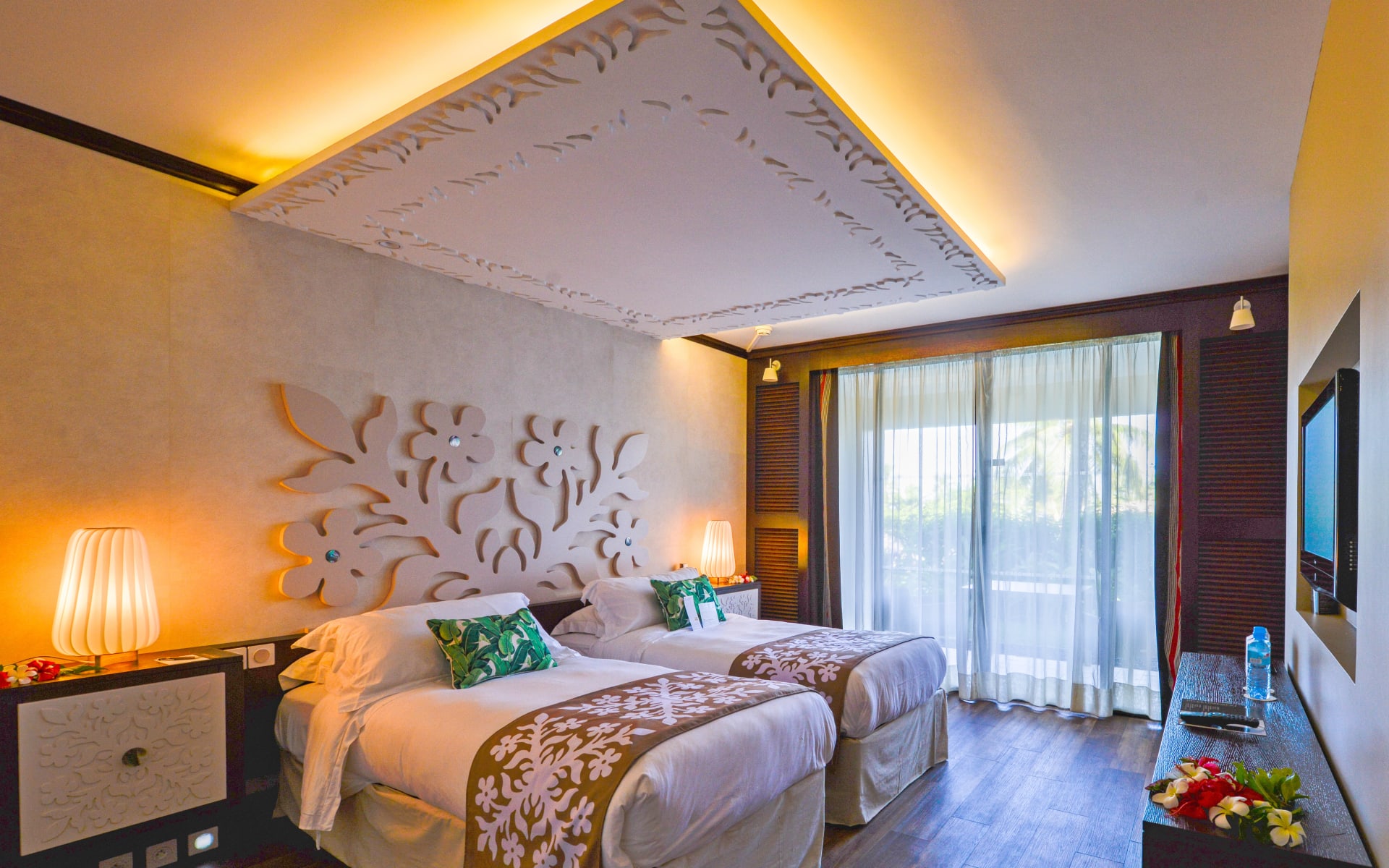 Twin beds are in a spacious room. 