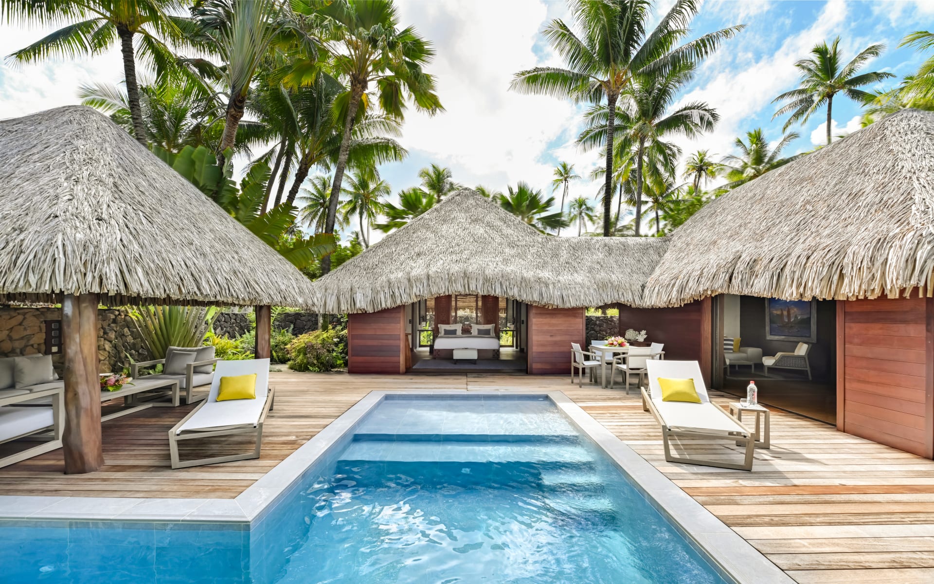 Private and secluded pool and deck area of a royal beachfront villa