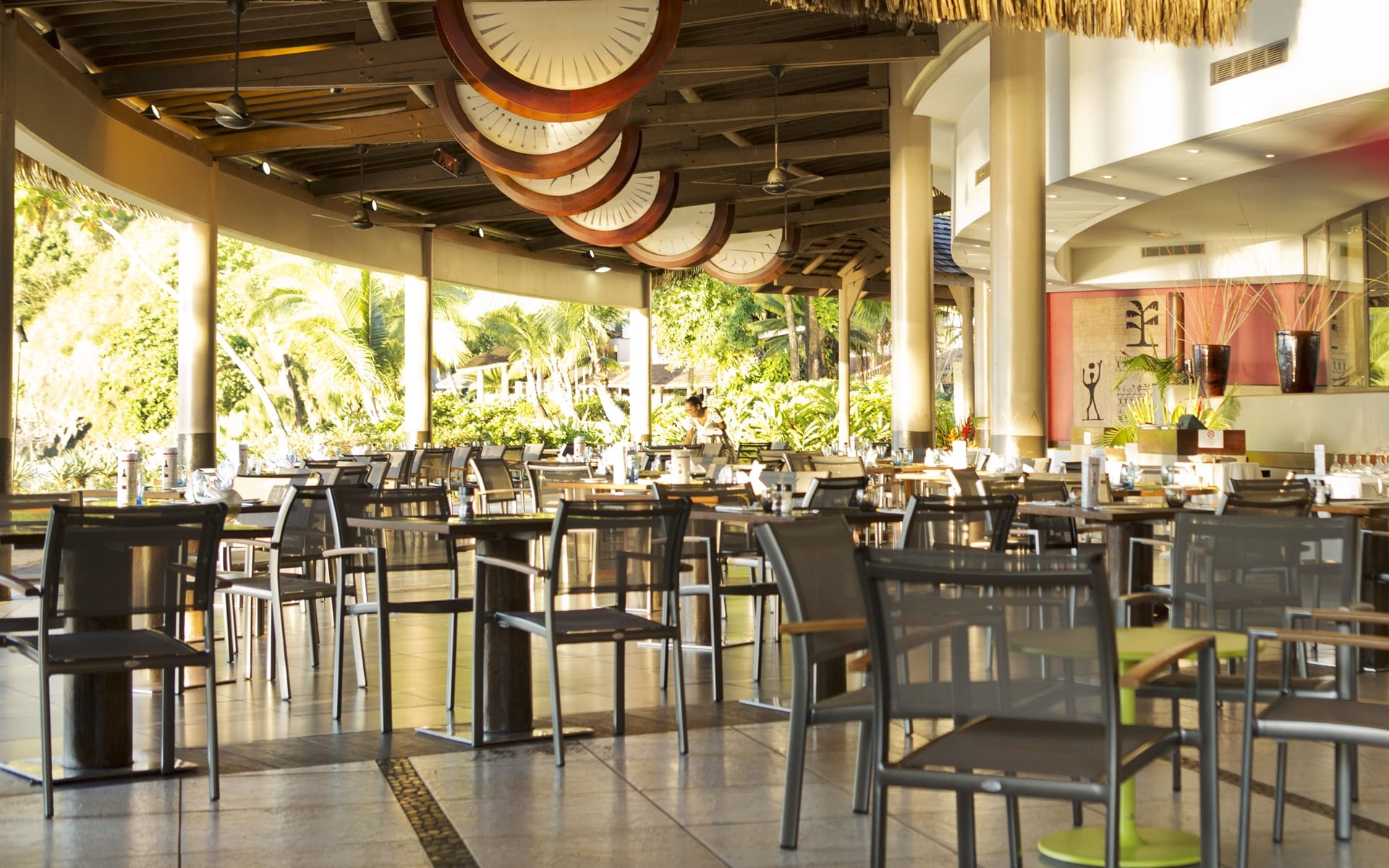 Restaurant with view of palm trees in the background