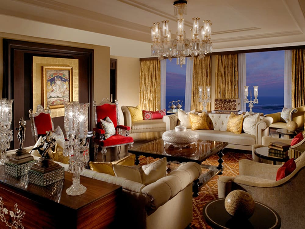 An opulent seating area with crystal chandelier 