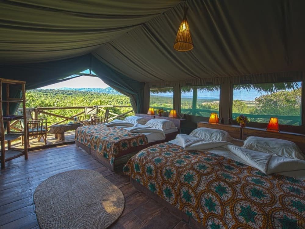 A tent with two double beds and a balcony