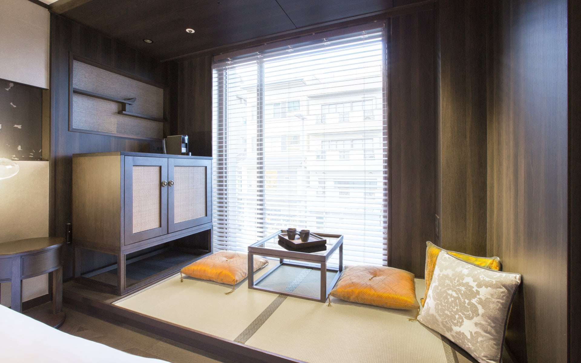 The twin room has a seating area with lots of pillows and tea-making facilities. 
