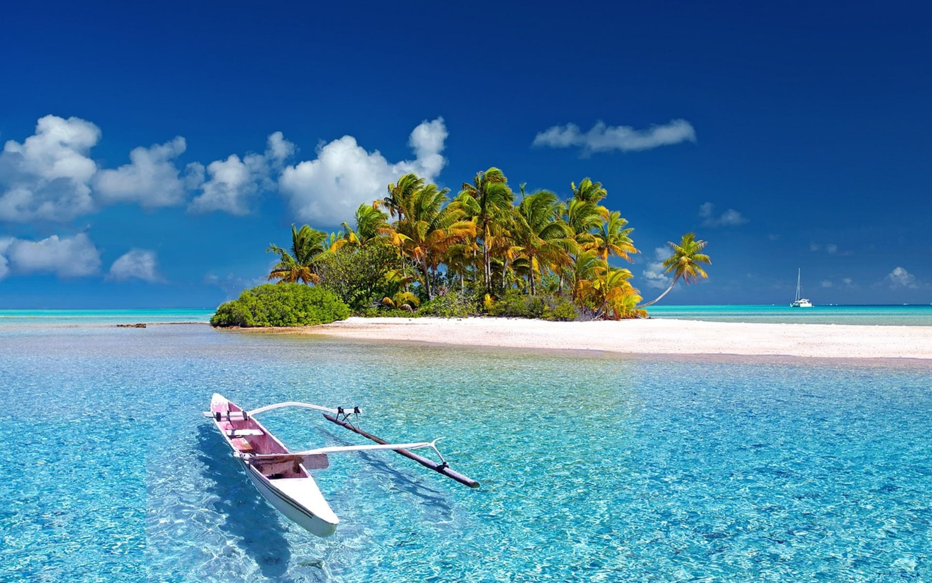 A white kayak is perched on a white island. 