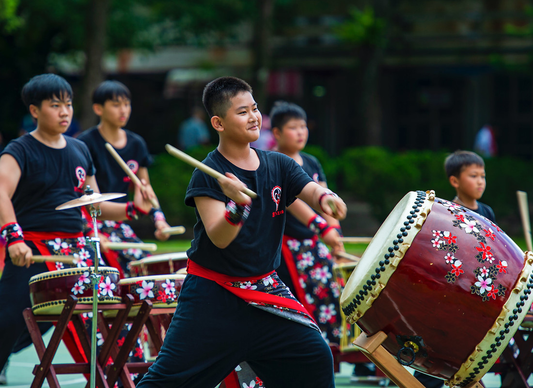 Boy Playing Taiko Japanese Drum
