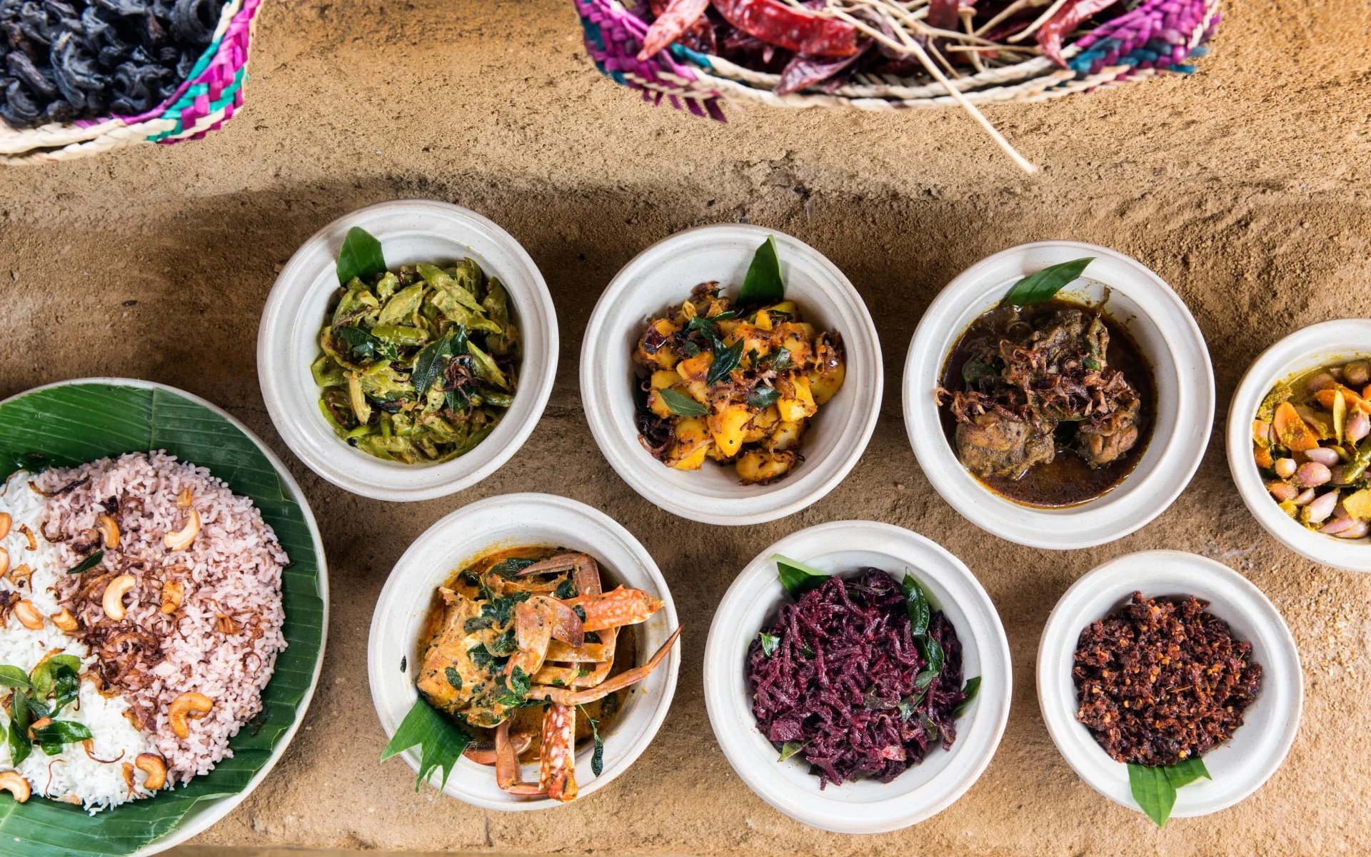 Sri Lankan food is placed in bowls. 