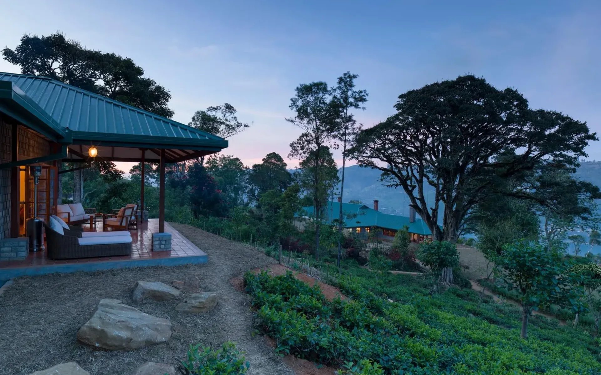 The veranda in the Owner's Cottage at Dunkeld overlooks a stunning scenery during sunset.