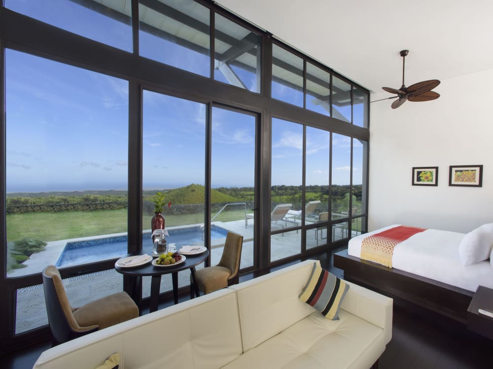 Bedroom and lounge overlooking a private pool