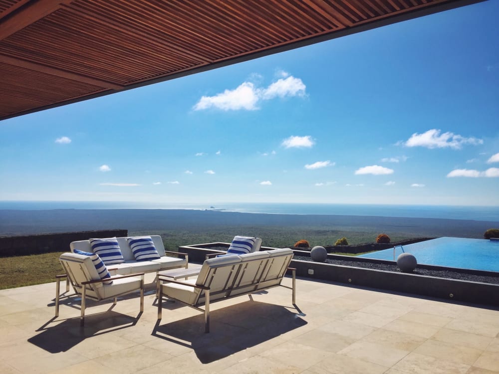 Deck chairs overlooking an infinity pool