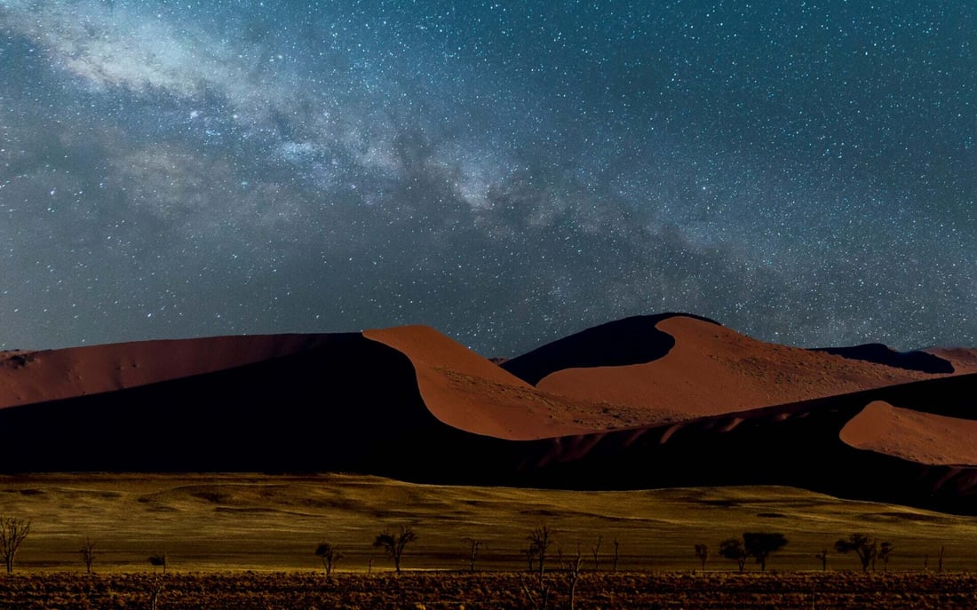 Go stargazing in Namibia in the desert.