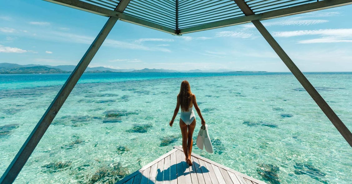 A lady prepares to snorkel in the Maldives. 