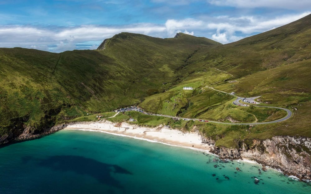 Keem Bay is surrounded by green hills and steep roads.