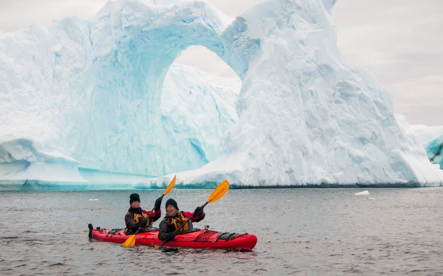 Two people kiyak in Antarctica.