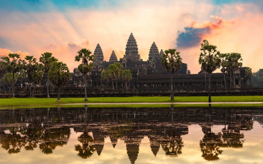 The sun rises over Angkor Wat.