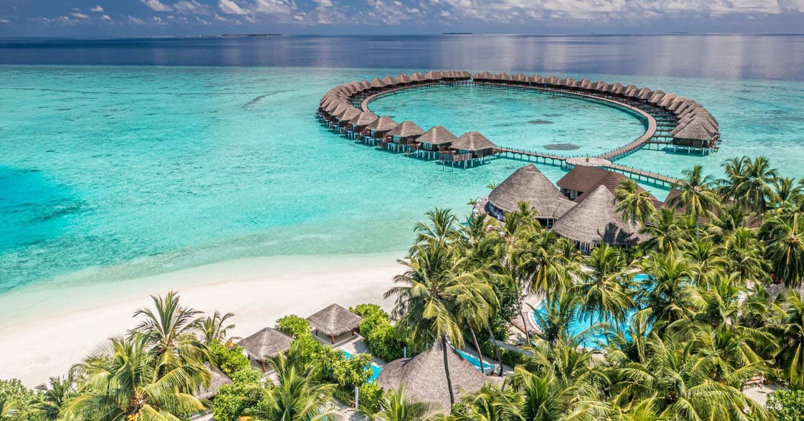 A luxury resort in the Maldives has typical overwater bungalows.