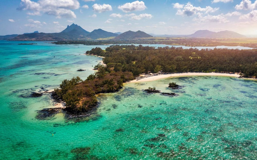 The  island of Mauritius is surrounded by turquoise waters.