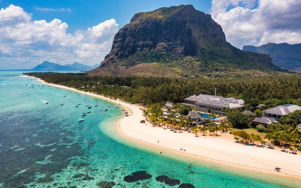 Mauritius island has white sandy beaches and mountains.