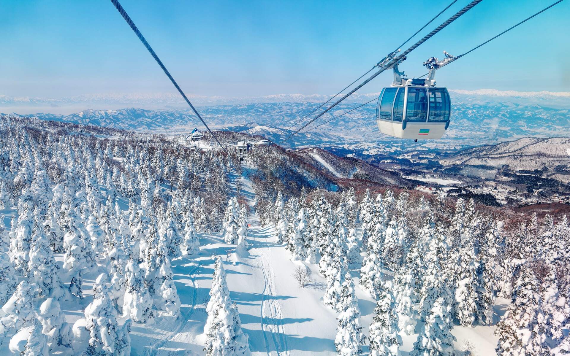 Head up the ski slopes in Japan on a cable car