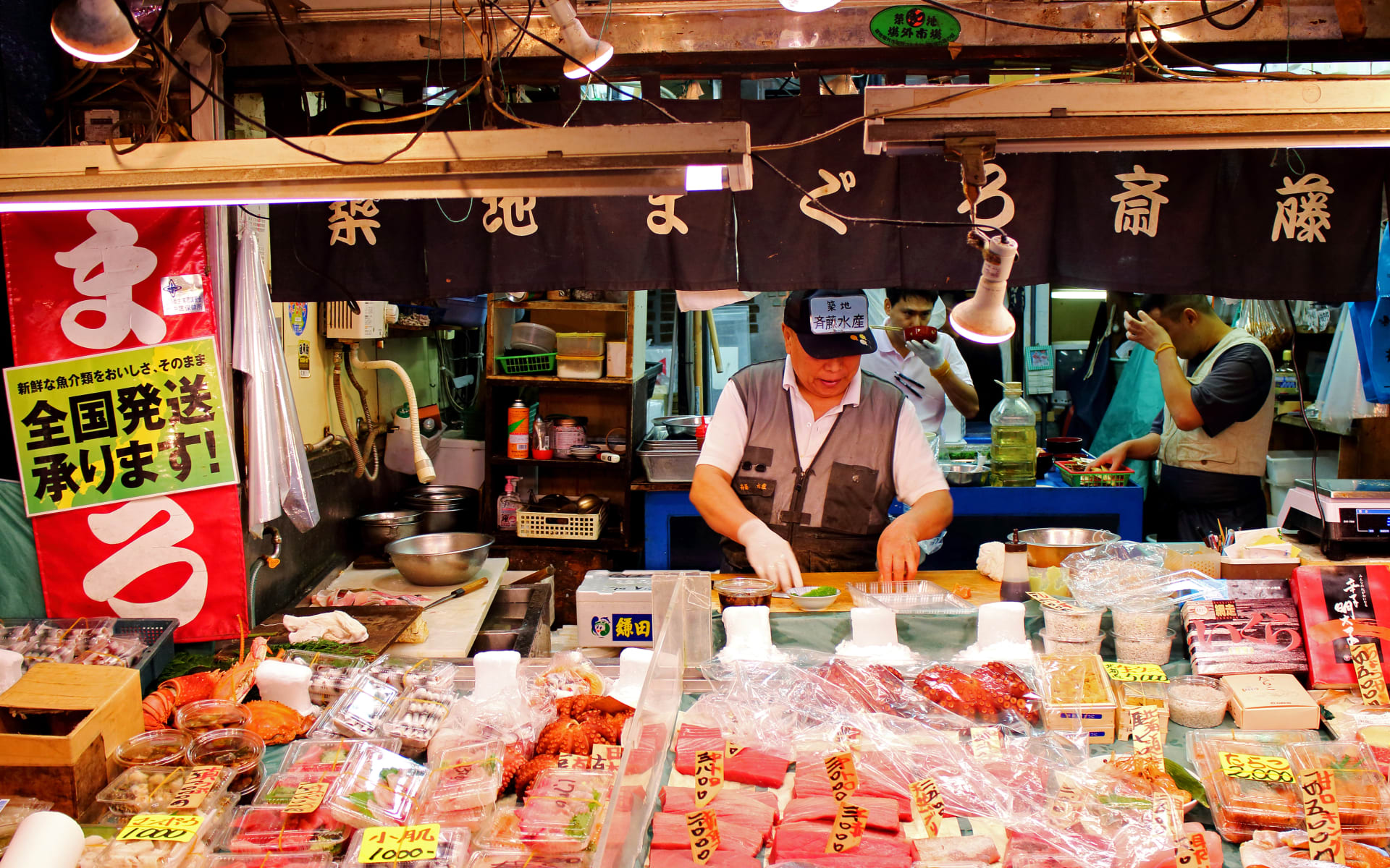 Workers serve fresh fish at the Tokyo market.