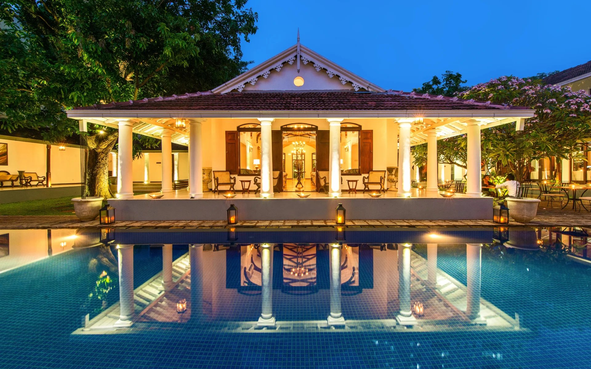 Uga Residence's lobby is a stylish temple-like building that's reflected into the swimming pool.