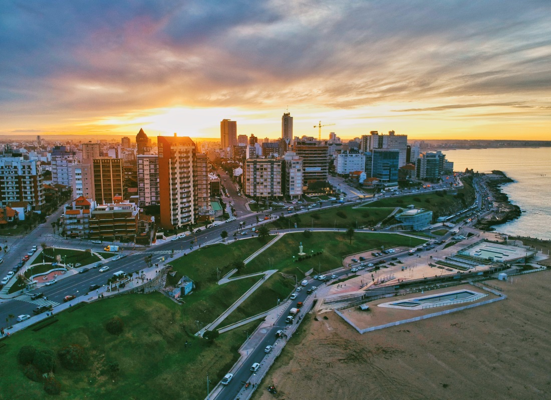 The skyscrapers in Buenos Aires look golden as the sun descends on the horizon.