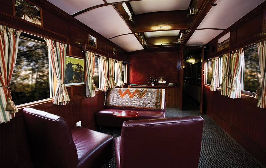 The Shongololo Express train traveling through South Africa, offering a luxurious and scenic journey across the diverse landscapes of the region