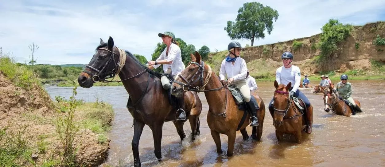 masai-riding-safari-kenya-fording-river