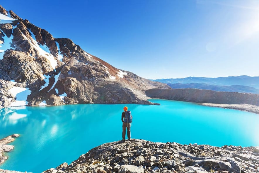hiker at a lake in Patagonia